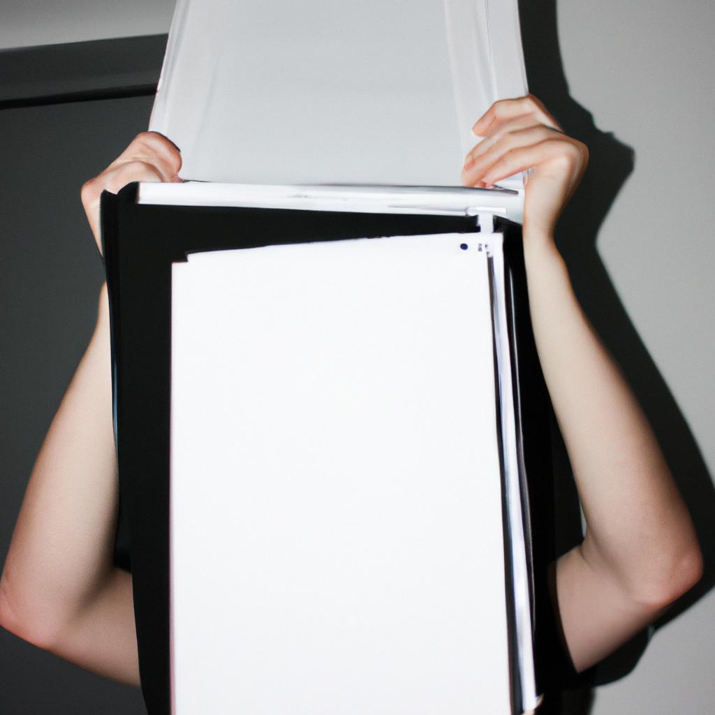 Person holding different printing papers